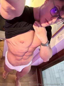 Shirt lifted to show the abs white briefs barely holding this hard