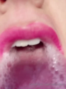 Licking a camera with spit
