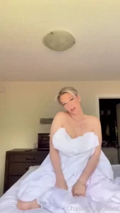 Sensual moves under the veil of a simple white sheet catch your