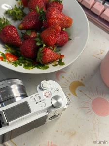 Me my camera and a plate of strawberries waiting to be shared yes with