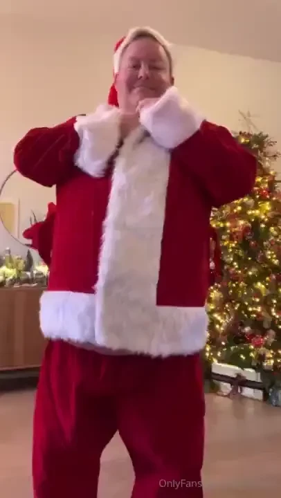 Santa showing off the belly and having a cookie part 7 