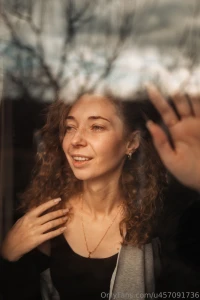 A cozy moment through the window glass where nature and thoughts