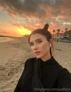 Amidst the evening beach s serene expanse a symphony of rolling waves