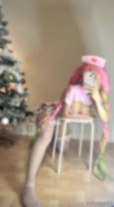 Mitsuri in a pink nurse dress