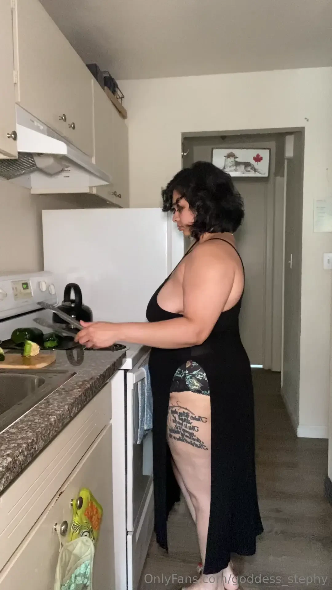 In the kitchen making dinner 