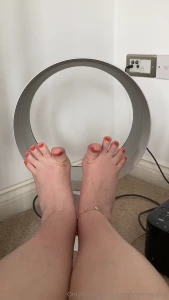 Hot day so i need the fan on new orange nail polish today hope you