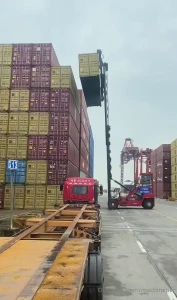 Picking an intermodal container with a reach stacker