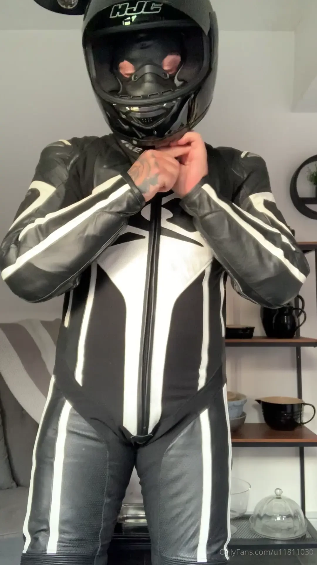 Rubber hooded anonymous leather biker 