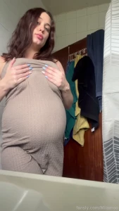 Watch me strip completely naked and rub baby oil over my huge prego