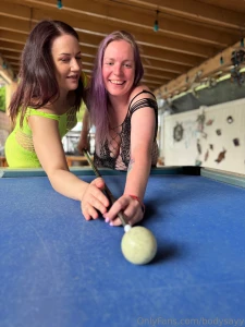 Showing her how to angle the stick with the balls because that s what